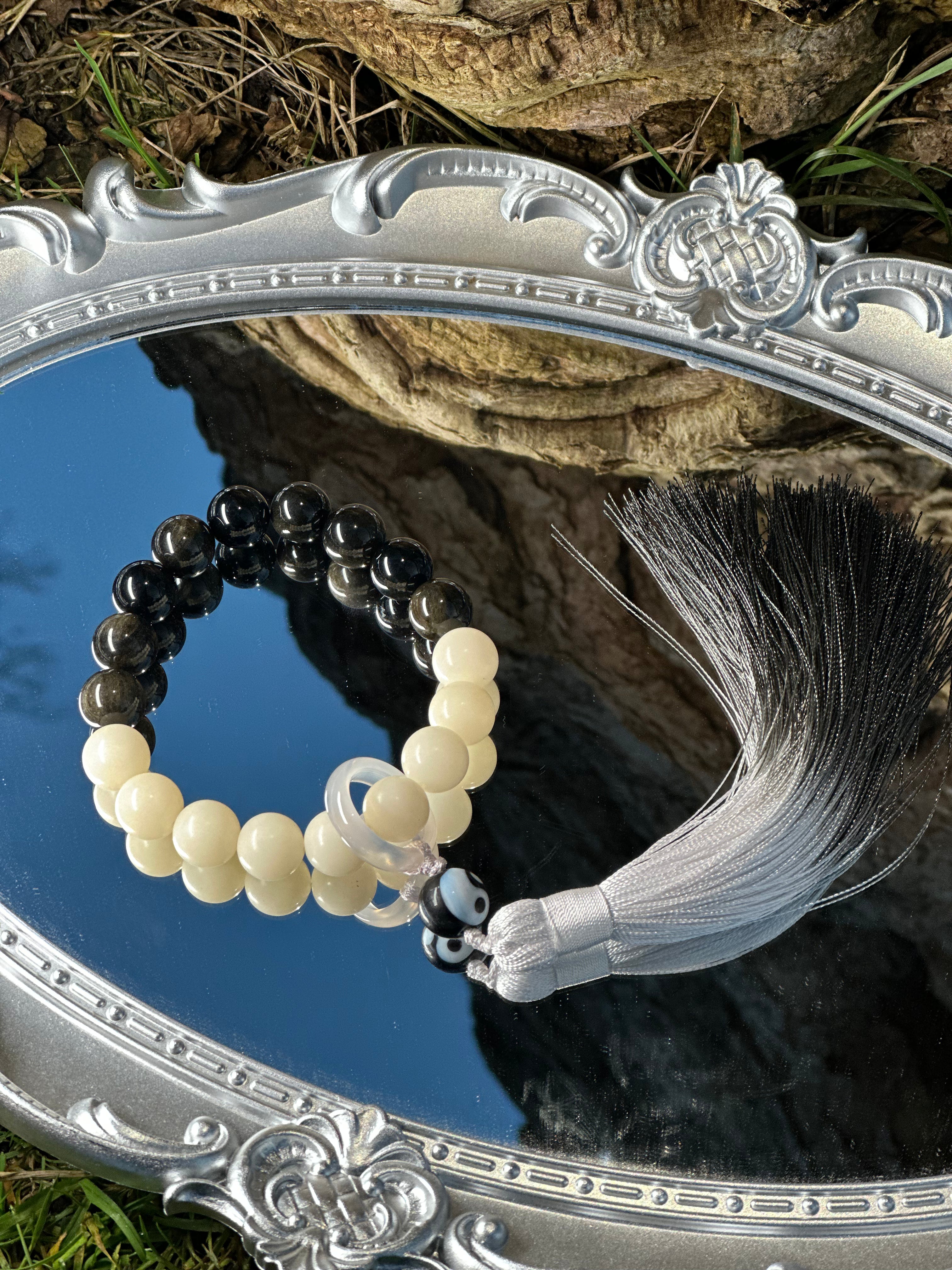 "Yin–Yang Inspired Bead Handheld with Tassel Handcrafted Everyday Object with Sliding Ring"